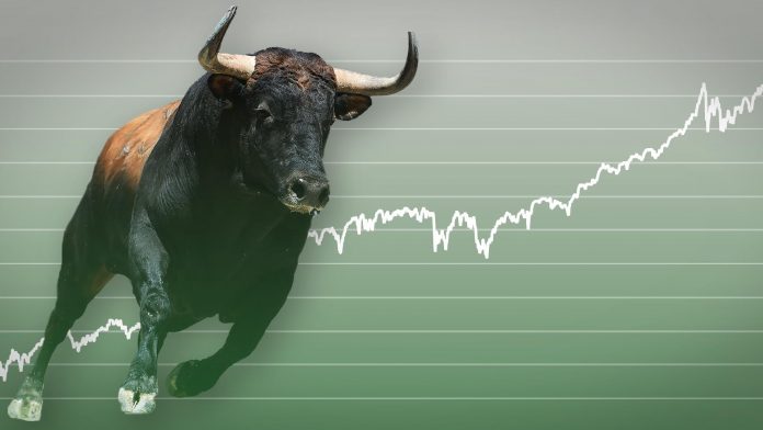 Picture of a bull running across a green chart with an upward trend line